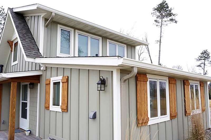 White gutters and downspouts on a two-story home